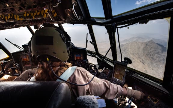 An RNZAF C130 landed in Kabul Afghanistan today and safely evacuated a number of New Zealanders and Australians.

Co-pilot Flight Lieutenant Michal-Louise Repko concentrating on the descent into Kabul.