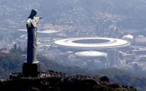 The statute of Christ the Redeemer stands above Rio.