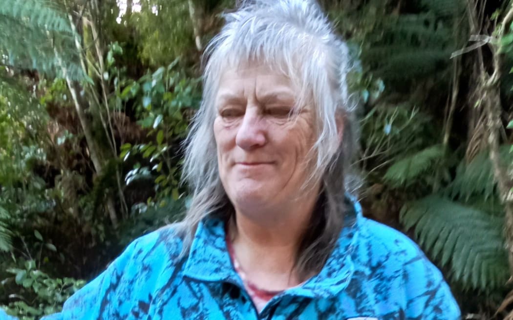 Landowner Heather Holland directs the first working bee on new track.