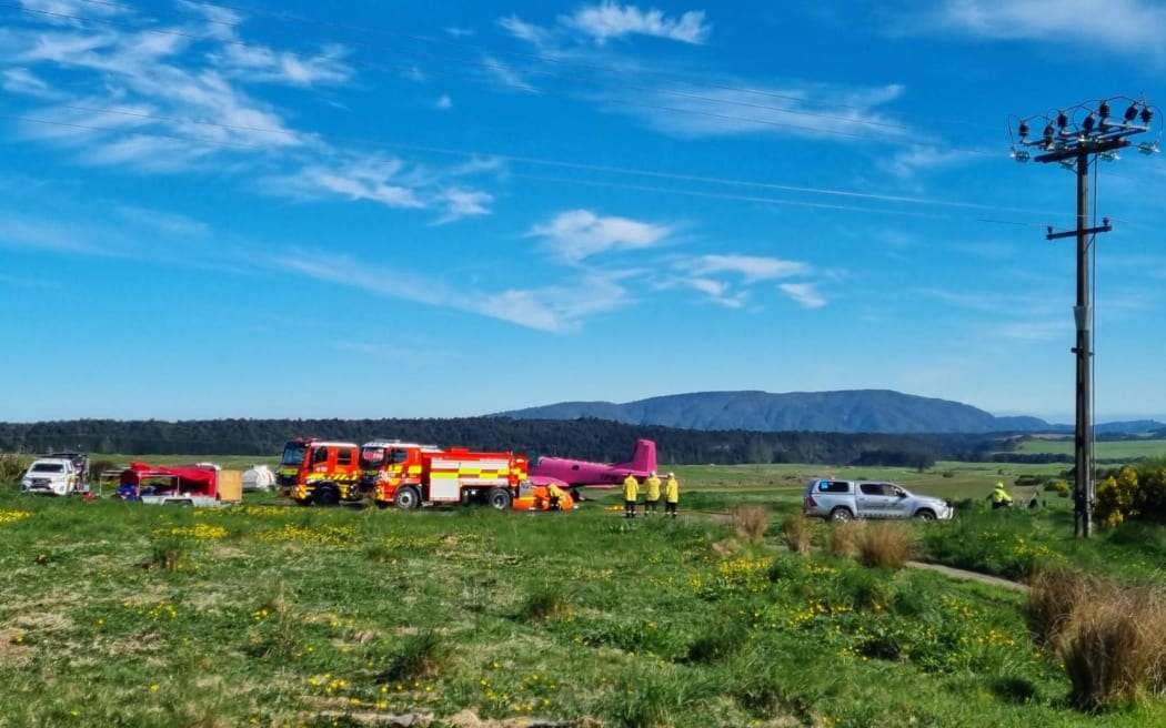 A number of helicopters with monsoon buckets and planes are fighting the blaze. The planes are landing at an airstrip not far from the fire where they appear to be pumped full of with water to drop.