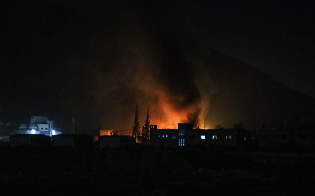 Smoke billows on the outskirts of the Syrian capital Damascus following Israeli airstrikes on December 9, 2024. - Israel conducted more than 100 air strikes on military targets in Syria on December 9 including a research centre Western countries suspected of having links to chemical weapons production in Damascus, a war monitor said. (Photo by Aaref WATAD / AFP)