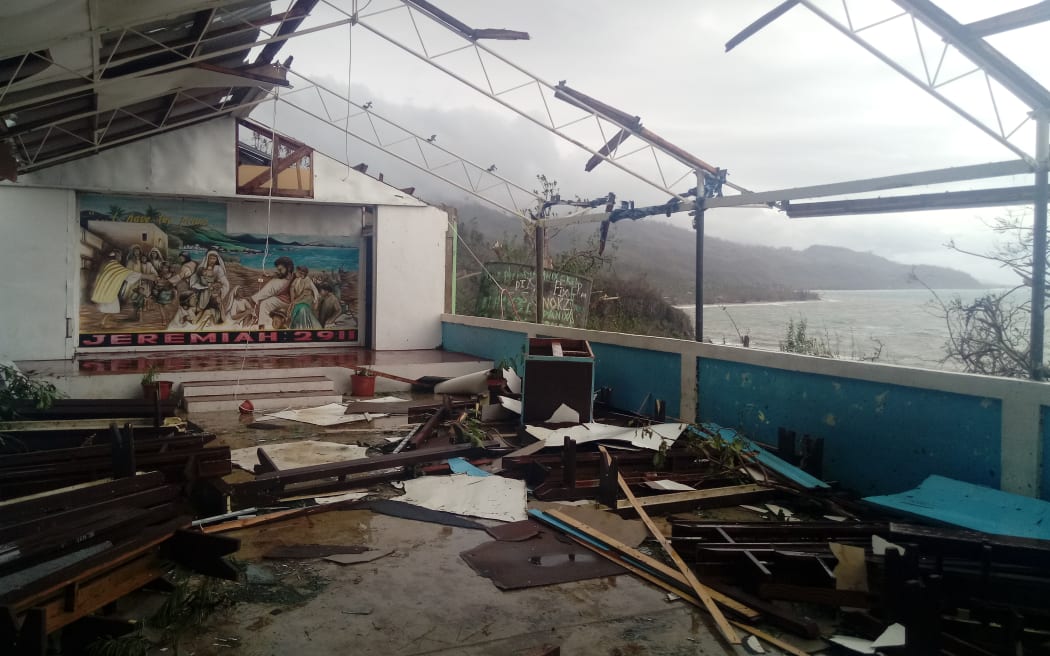 The damaged chapel at Llanwadi Secondary School overlooks the devastated Pentecostal landscape. Cyclone Harold, Vanuatu, 2020.