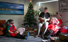 Staff celebrating Christmas at Antarctica's Scott Base share Secret Santa gifts.