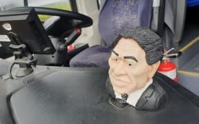 A mini bust of Winston Peters on the dashboard of the NZ First campaign bus.