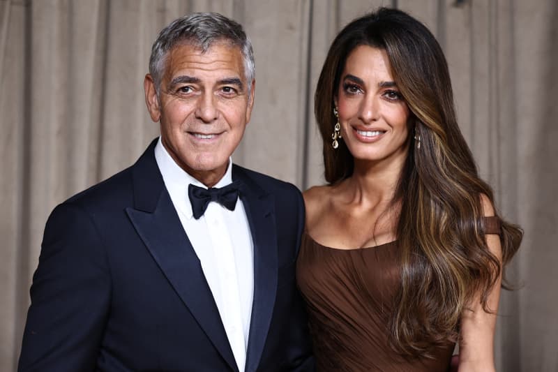 US actor George Clooney and Lebanese-British barrister Amal Clooney arrive to attend The Albies hosted by the Clooney Foundation at the Natural History Museum in London on October 3, 2025. The Clooney Foundation for Justice (CFJ), provides free legal support in defense of free speech and women’s rights in more than 40 countries. The Albies is the Clooney Foundation for Justice's annual event honoring courageous defenders of justice.