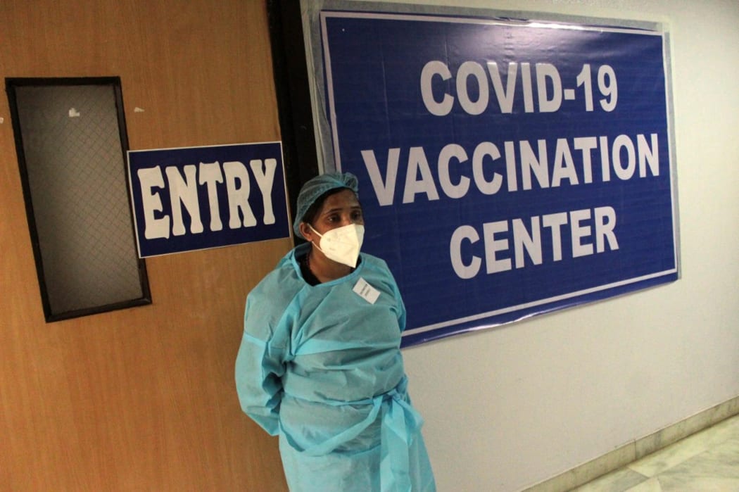 A healthcare worker at a vaccination centre in New Dehli, India.