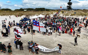 An estimated 700 people gathered on Northland’s Ruakākā Beach on Sunday to protest a proposed sand mining operation.