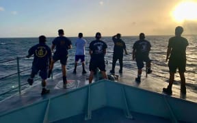 Members of the RMI Sea Patrol vessel RMIS Lomor 03, a Pacific Forum-class patrol boat, scan for a missing 37-foot sea ambulance during an ongoing search on March 9, 2025. The search entered its fifth day for four crew members—a captain, nurse practitioner, health assistant, and community health outreach worker—missing since March 3 after departing Majuro for Mili Atoll in the Republic of the Marshall Islands (RMI). (Photo courtesy MIPD Sea Patrol Officer Kattil