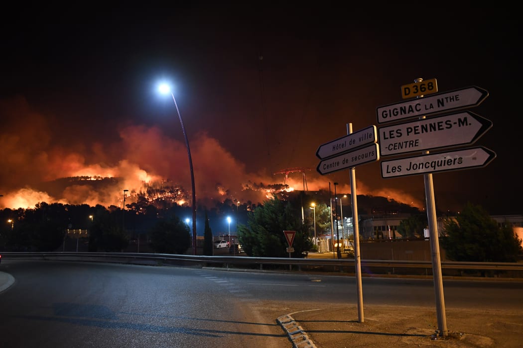 1500 firefighters are battling wildfires north of Marseille, which have forced more than 1000 people to flee their homes.