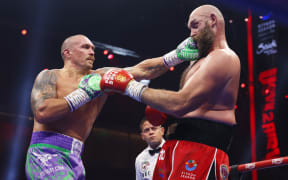 Oleksandr Usyk punches Tyson Fury during their unified world heavyweight championship fight. 22 December 2024.