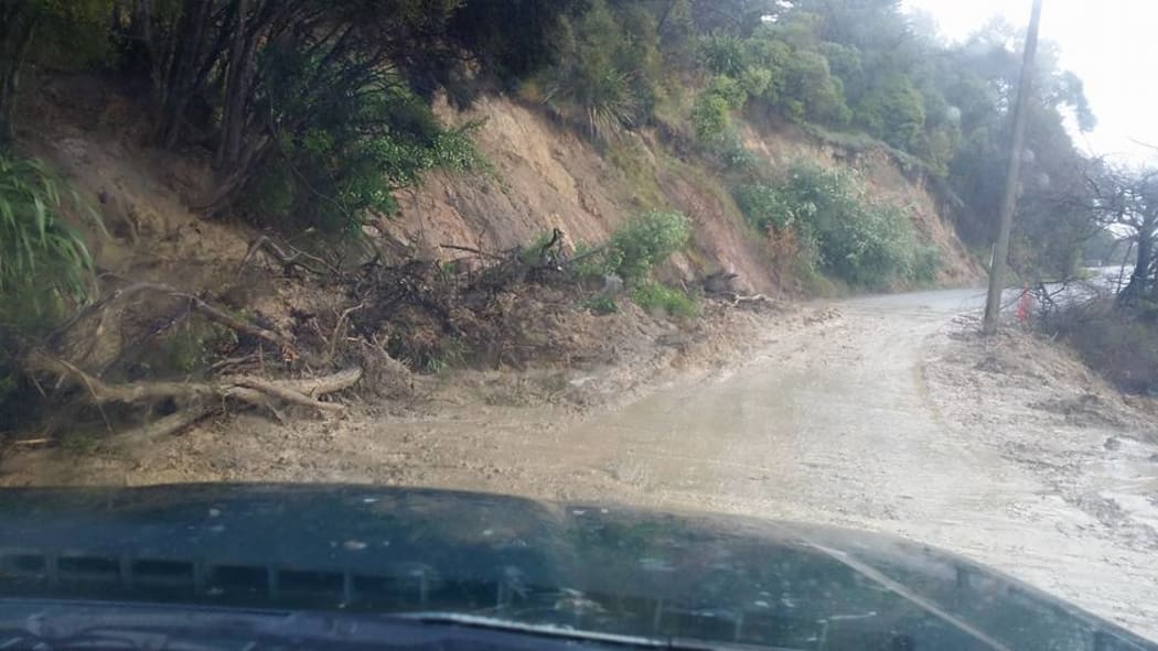A slip covers part of a road in Akaroa on Banks Peninsula.