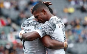 Fiji's Vilimoni Botitu and Aminiasi Tuimaba celebrate a try against Australia.