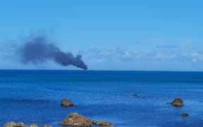 A motor launch on fire off Wellington's South Coast