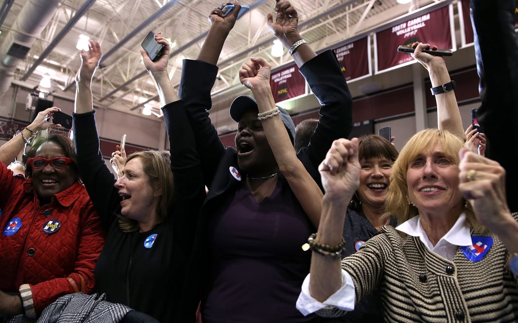 Supporters of Democratic presidential candidate Hillary Clinton celebrate her win in the South Carolina Primary over Democratic rival Bernie Sanders.