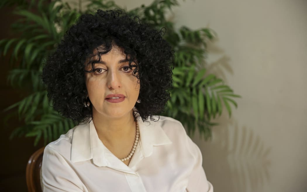 Narges Mohammadi sits in her apartment in Tehran on January 23, 2025. She received the 2023 Nobel Peace Prize for advocating women's rights and freedom and is currently on leave from prison. (Photo by Nooshin Jafari / Middle East Images via AFP)