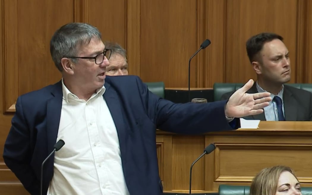 Labour MP Duncan Webb stands up to defend the display of stickers on Hana-Rawhiti Maipi-Clarke's laptop, in the House on 24 July, 2024.