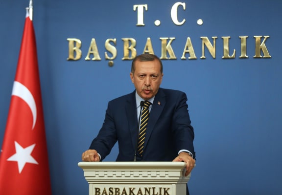 Prime Minister Recep Tayyip Erdogan announces the new cabinet members.
