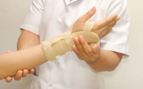 someone with a brace on their hand