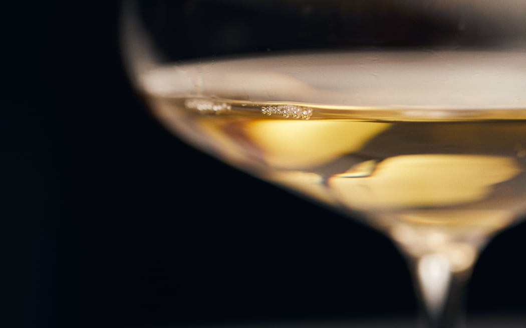 a close up of a glass of white wine
