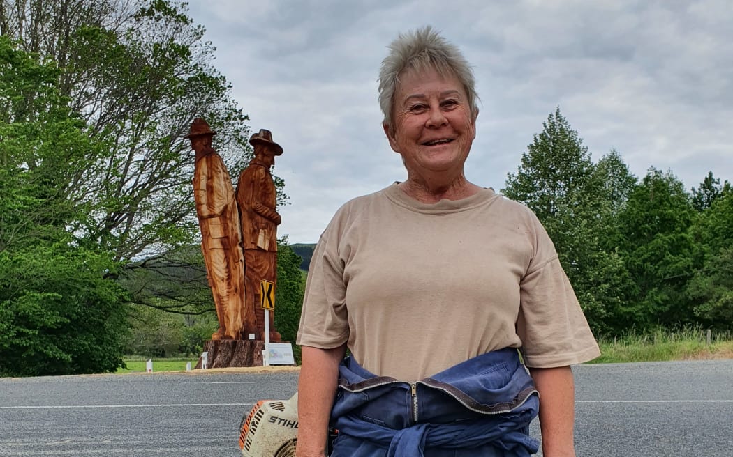 Rissington resident Bronwyn Farquharson tidies up before Armistice Day on 11 November 2022 for a ceremony marking the completion of the sculpture