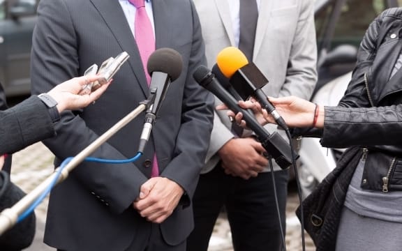 Journalists making media interview with businessperson or politician