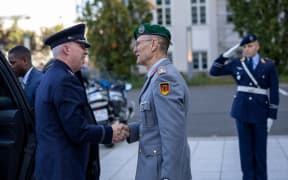 U.S. Space Force Gen. Stephen N. Whiting, U.S. Space Command commander and Multinational Force-Operation Olympic Defender commander, greets German Ministry of Defence Director-General for Military Strategy and Operations Lt. Gen. Gunter Schneider during a formal accessions ceremony in Berlin, Germany, Oct. 14, 2024. The multinational named operation represents a growing commitment among the closest allies in space to jointly strengthen defenses and deter aggression, ensuring space remains a domain that benefits all of humanity. (Courtesy photo)