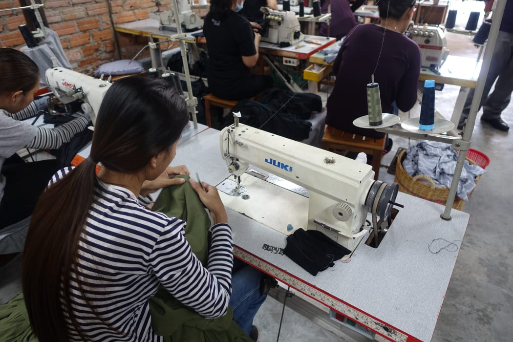 A machinist in a Cambodian factory.