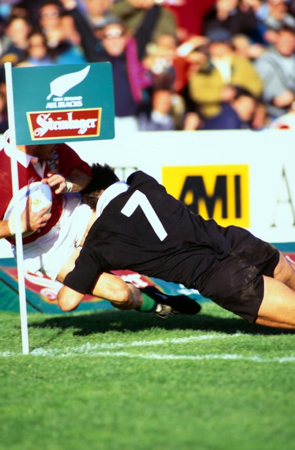 Michael Jones makes a try-saving tackle during the 1993 clash between the Lions and the All Blacks in Wellington.