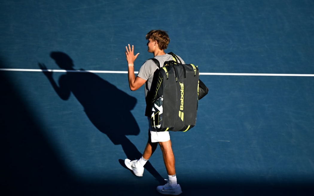 Isaac Becroft of New Zealand thanks the crowd after losing his first round match against Zizou Bergs of Belgium during day one of the ASB Classic men's singles.
