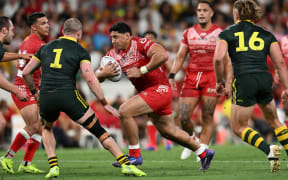 Jason Taumalolo (centre) of Tonga XIII in action during the 2024 Pacific Championships match between the Australian Kangaroos and Tonga XIII at Suncorp Stadium in Brisbane.