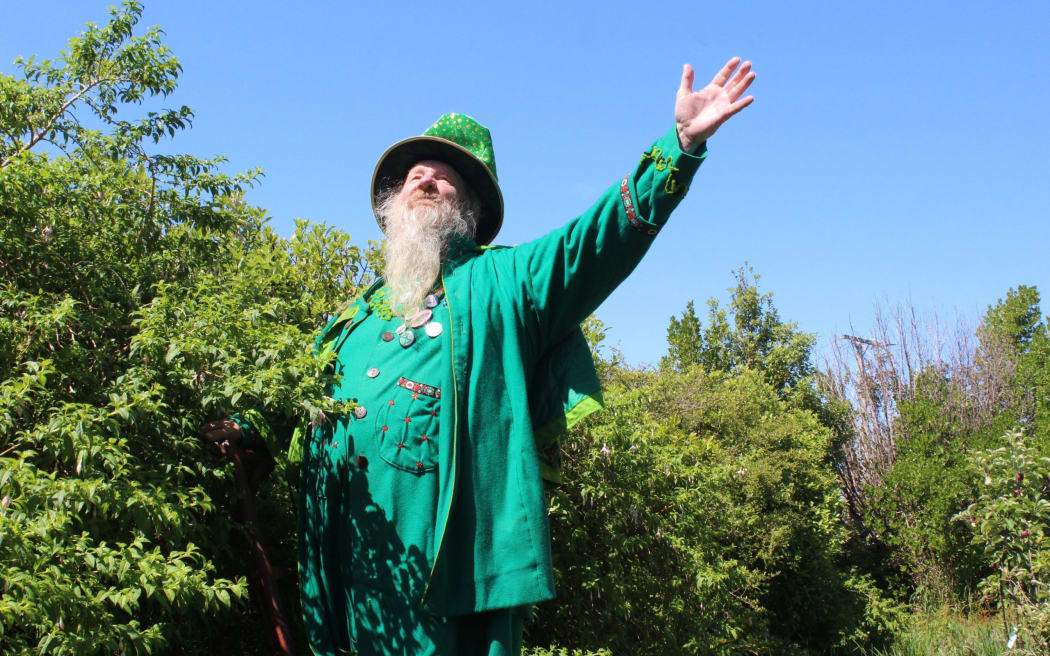 Noel Peterson in his garden, embracing the sun and welcoming its warmth.