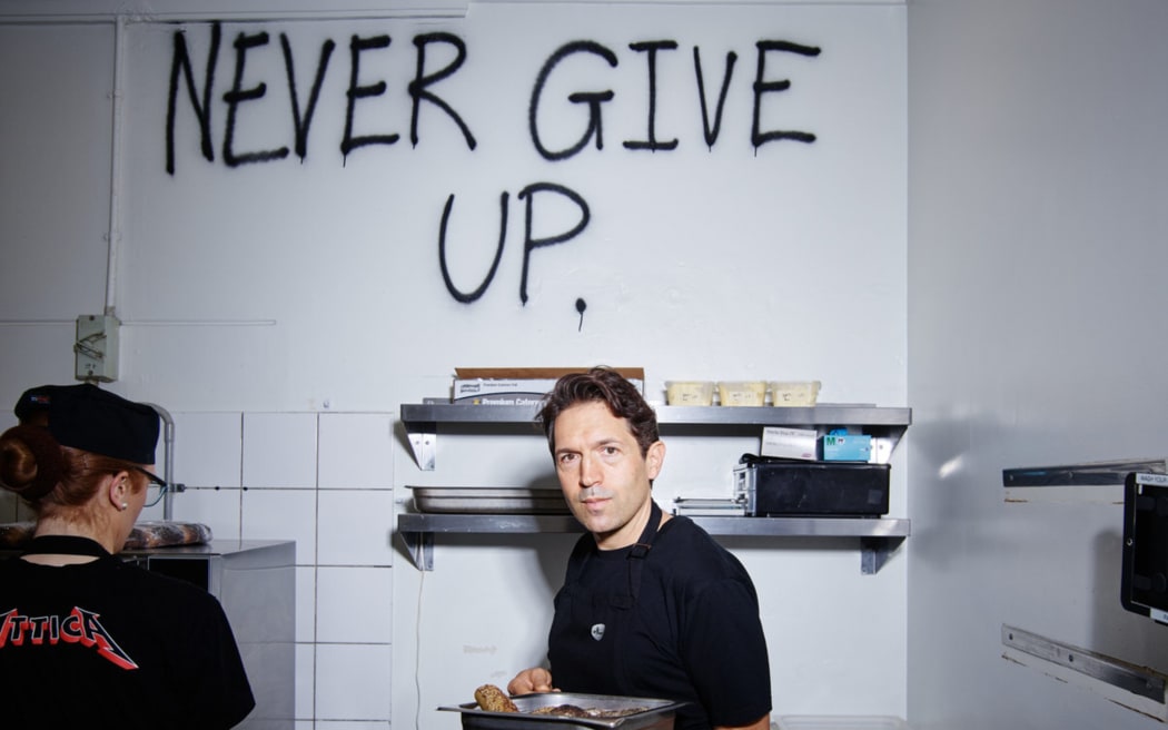 Ben Shewry in the Attica kitchen. He spray painted the mantra 'Never Give Up' on the wall during the Covid pandemic in 2020.