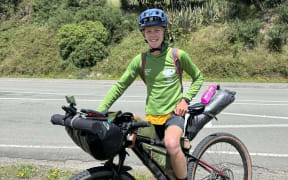 Mahe Braaksma, 14, pauses for a photo on his bike which is packed with his camping gear and clothes.