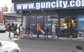 Queues at Gun City as New Zealand prepares for Covid-19 lockdown.