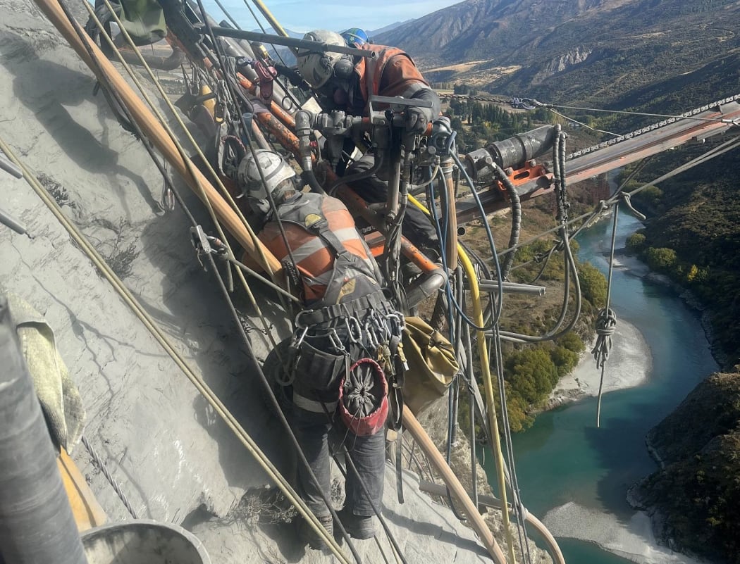 Crews secure final bolts on Yates Feature, on the Nevis Bluff