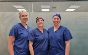 Waikato Hospital cardiothoracic nurse and surgical assistants Kelsey Abercrombie, Jacque Roberts, and Georgia Miller.