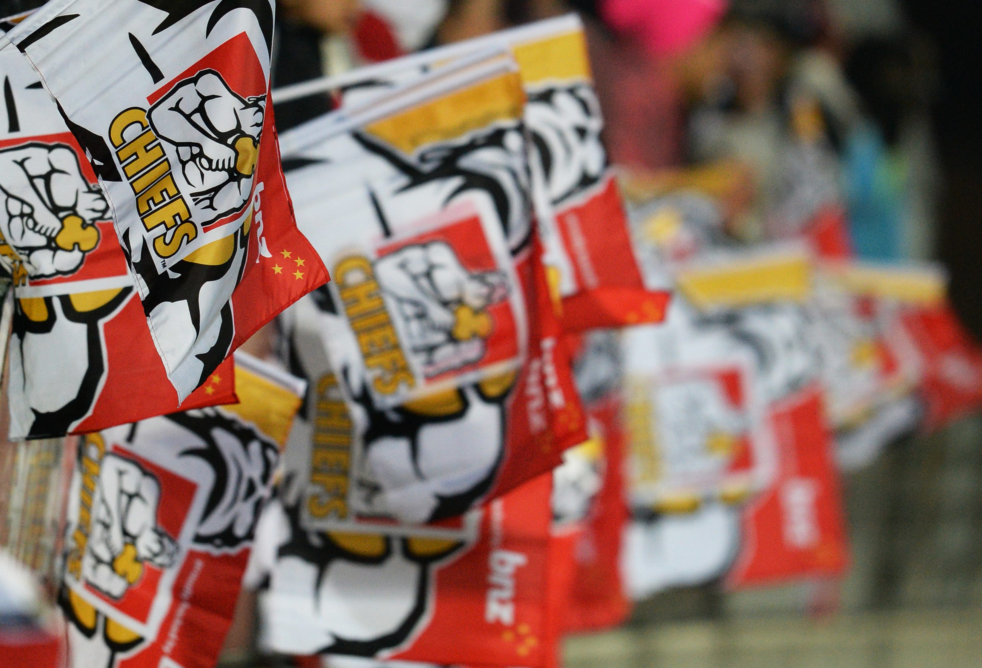 Flags are waved during a Chiefs vs Hurricanes game in 2013