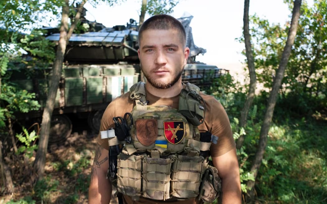 Oleh, a Ukrainian squad leader, who's been fighting in the Donbas region, says he wants to protect his family. (ABC News: Daniel Pannett)