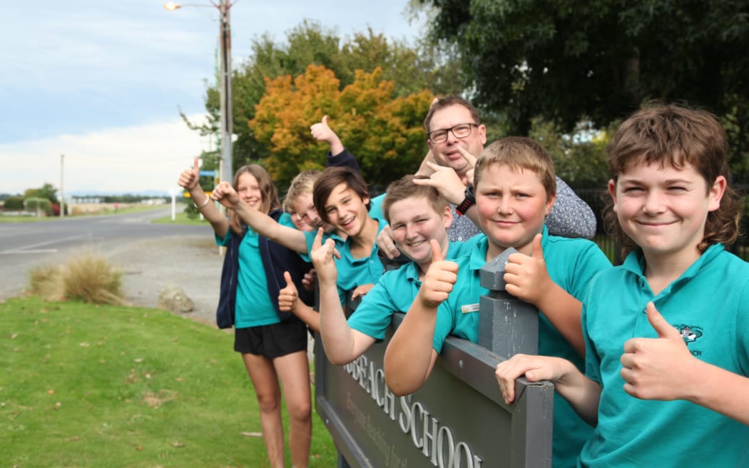 Longbeach School principal Neil Simons with pupils (front to back) Harry O'Connell, George Lash, Hunter Illingworth, Principal Neil Simons, Benji Skevington, Henry Pottinger, Grace Harrison-Hastie, and Rose McKay.