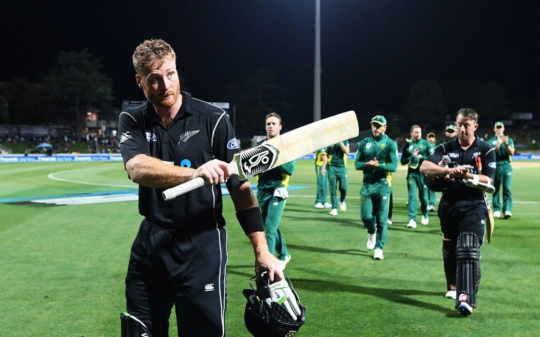 Martin Guptill walks off Seddon Park after scoring an unbeaten 180 and beating South Africa.