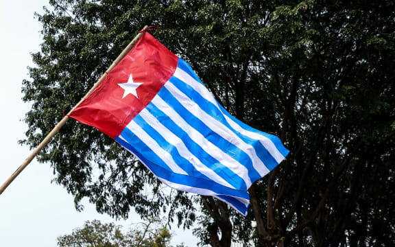 A Papuan student waves the West Papua flag, the Morning Star during a rally in Jakarta, Indonesia, on 28 August, 2019.