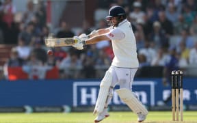 England's Ben Duckett hits a boundary on day two of the fourth cricket test match between England and India at Old Trafford, in Manchester.