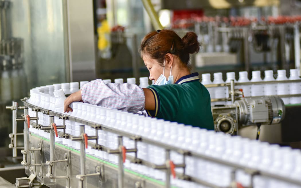 QINGZHOU, CHINA - AUGUST 25, 2023 - A worker works on a production line at a workshop of a pesticide manufacturing enterprise in Qingzhou Economic Development Zone, East China's Shandong province, Aug 25, 2023. (Photo by Costfoto/NurPhoto) (Photo by CFOTO / NurPhoto / NurPhoto via AFP)