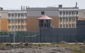 This photo taken on June 2, 2019 shows buildings at the Artux City Vocational Skills Education Training Service Center, believed to be a re-education camp where mostly Muslim ethnic minorities are detained, north of Kashgar in China's northwestern Xinjiang region. - As many as one million ethnic Uighurs and other mostly Muslim minorities are believed to be held in a network of internment camps in Xinjiang, but China has not given any figures and describes the facilities as Ã’vocational education centresÃ“ aimed at steering people away from extremism. (Photo by GREG BAKER / AFP) / TO GO WITH China-Xinjiang-media-rights-press,FOCUS by Eva XIAO        (Photo credit should read GREG BAKER/AFP via Getty Images)