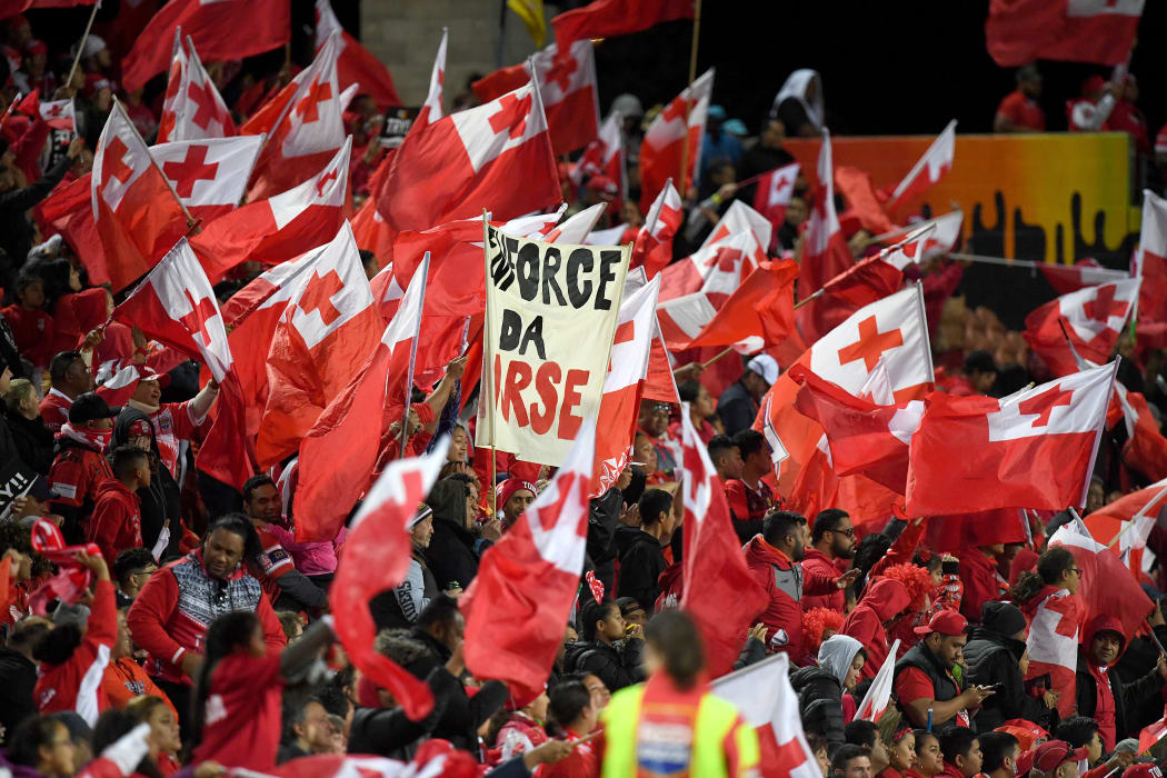 Tongan fans celebrate their team's win over Great Britain in Hamilton