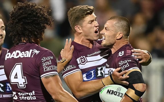 Sea Eagles Kieran Foran (R) celebrates after scoring a try during the NRL Semi Final match between the Manly Sea Eagles and the Sydney Roosters, at BB Print Stadium, Mackay, QLD, Friday, September 17, 2021. (AAP Image/Dave Hunt) NO ARCHIVING, EDITORIAL USE ONLY