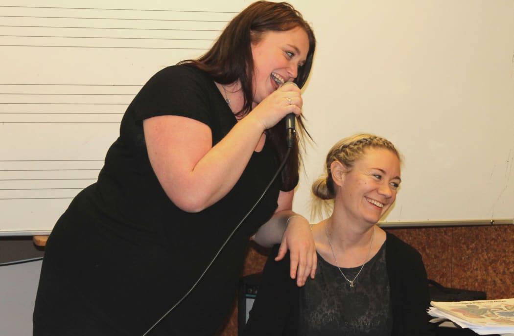 A photo of All Girl Big Band vocalists, Kate Taylor and Anna Whitaker.