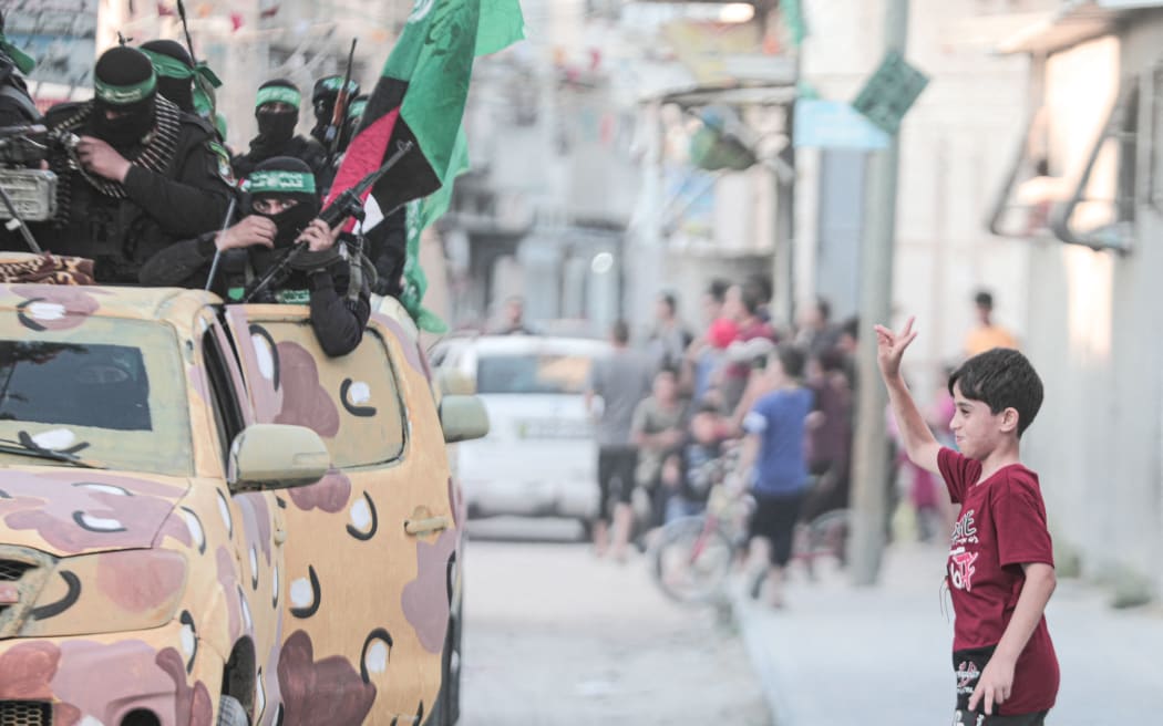 Members of Ezz al-Din al-Qassam brigades, the military wing of the Palestinian Hamas movement, take part in a military parade in Gaza City, on 8 June , 2021.