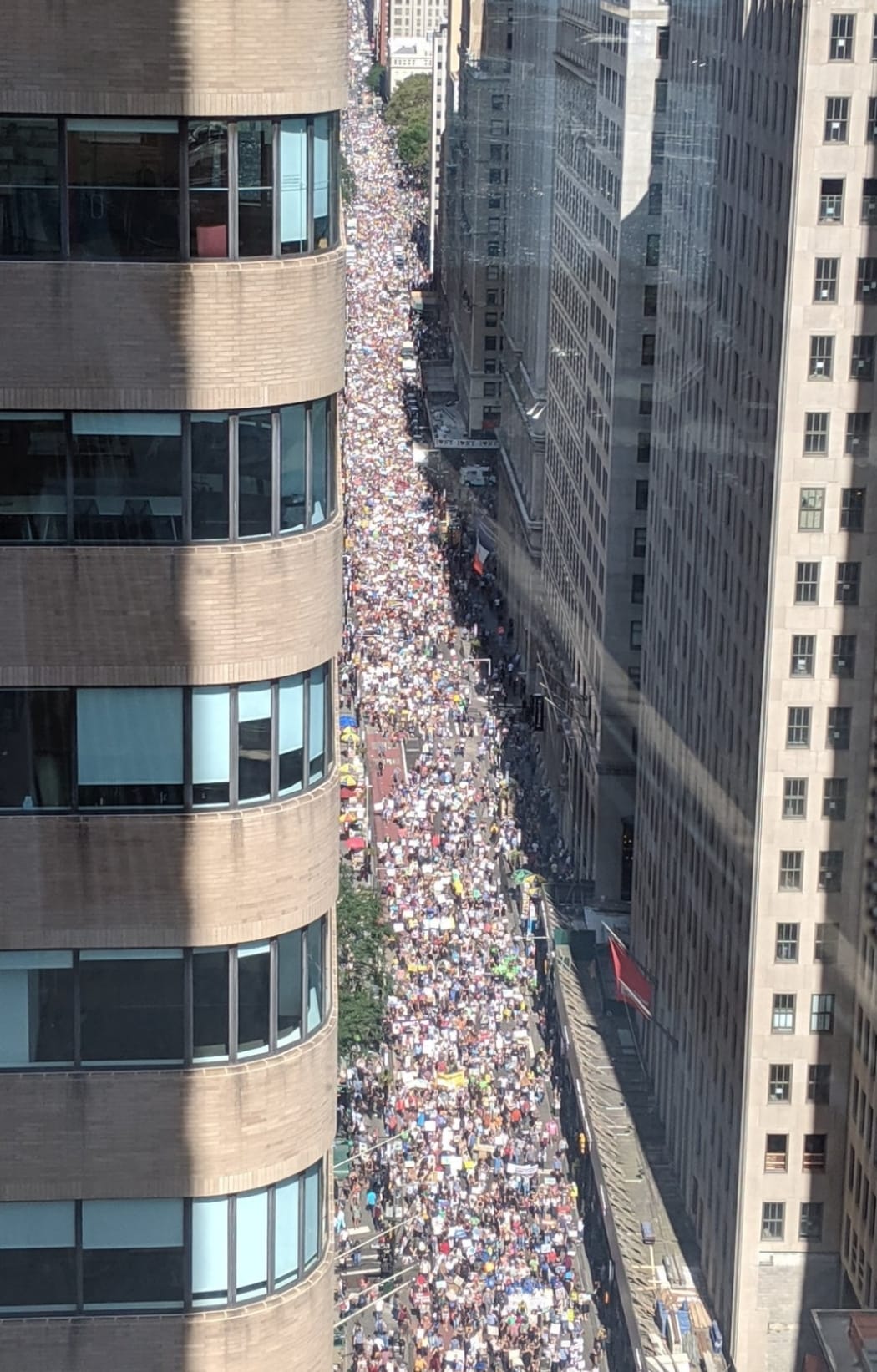 Protesters march through New York as the UN Climate Summit opens.
