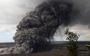 This US Geological Survey (USGS) image released May 15, 2018, shows an ash plume rising following a massive volcano eruption on Kilauea volcano in Hawaii.